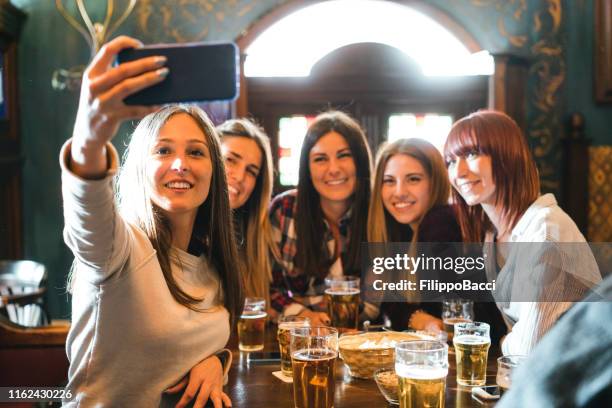 friends selfie at the pub - irish culture stock pictures, royalty-free photos & images