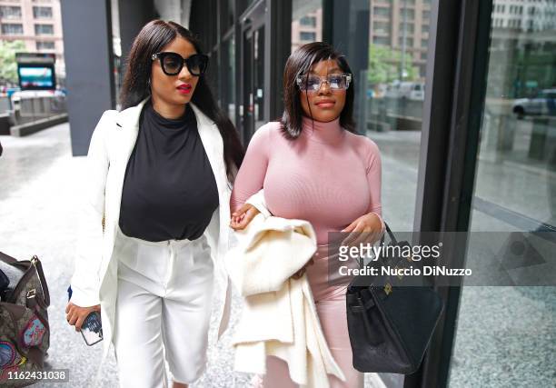 Supporters of singer R. Kelly, Azriel Clary and Joycelyn Savage leave after the singer's arraignment at the Dirksen Federal Building on July 16, 2019...