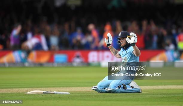 Ben Stokes of England apologises after the ball hits the bat of and goes for four over throws as he makes his ground the Final of the ICC Cricket...