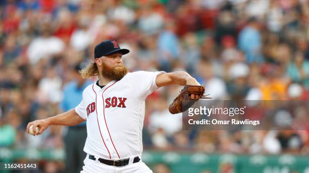 Starter Andrew Cashner of the Boston Red Sox pitches at the top of the first inning of the game against the Toronto Blue Jays at Fenway Park on July...