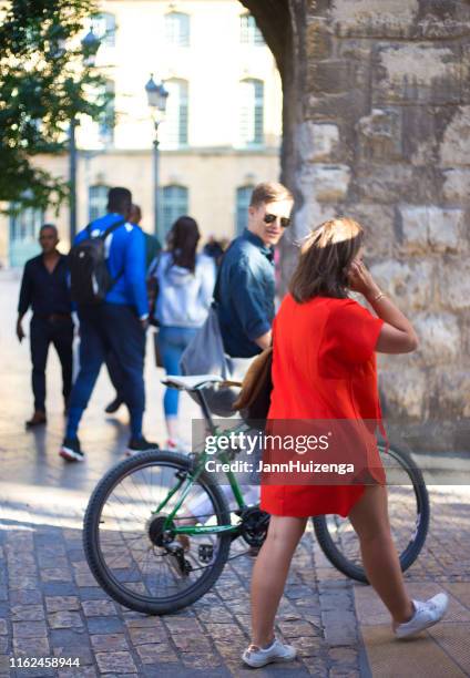 aix-en-provence, france: young couple with bike at dusk - andar en bicicleta imagens e fotografias de stock
