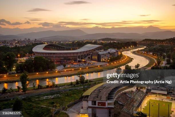 sunset view of mount vodno, tose proeski national arena, vardar river and sports complex, skopje, north macedonia - skopje stock pictures, royalty-free photos & images