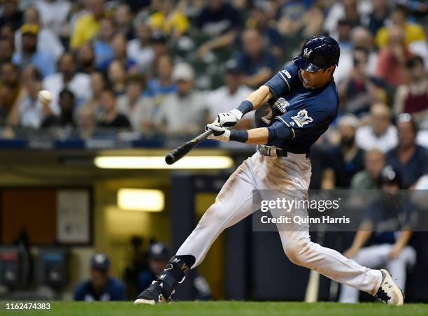 Christian Yelich of the Milwaukee Brewers hits a grand slam in the seventh inning against the Atlanta Braves at Miller Park on July 16, 2019 in...