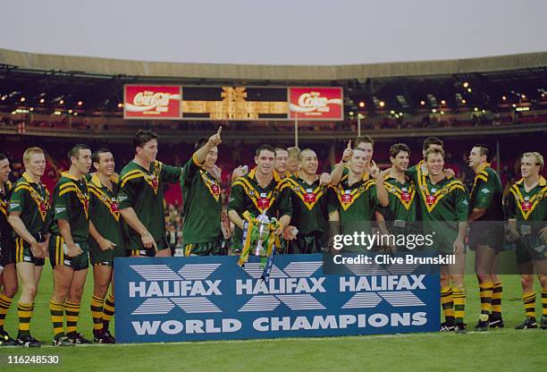 The Australian team pose with a Halifax bank sign after beating England 8-16 in the final of the Rugby League World Cup at Wembley Stadium, London,...