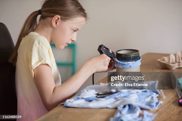 girl (12-13) using recycled fabric to make something new - resourceful stock pictures, royalty-free photos & images