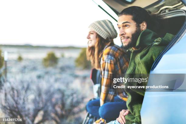 couple outdoor adventure at sunset experiencing golden sunset freedom in western colorado - colorado hiking stock pictures, royalty-free photos & images