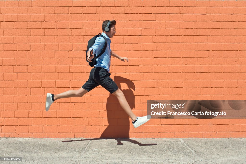 Young student runs to school