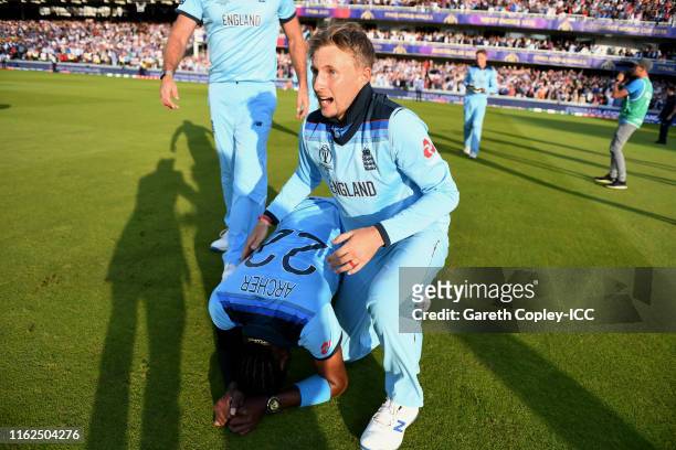Joe Root and Jofra Archer of England celebrate after winning the Final of the ICC Cricket World Cup 2019 between New Zealand and England at Lord's...
