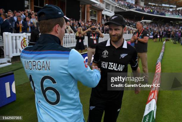England captain Eoin Morgan shakes hands with New Zealand captain Kane Williamson after winning the Final of the ICC Cricket World Cup 2019 between...
