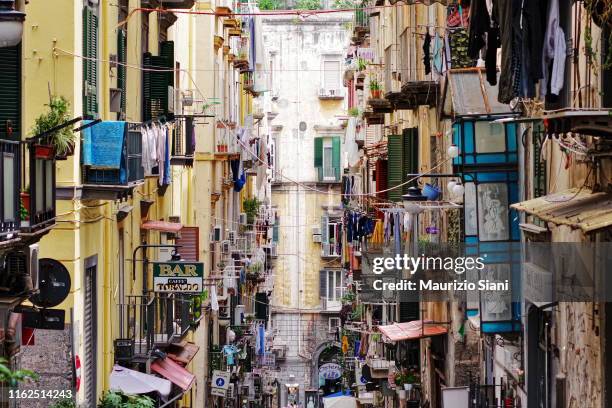 naples, quartieri spagnoli; low angle view of buildings and narrow street - napoli stockfoto's en -beelden