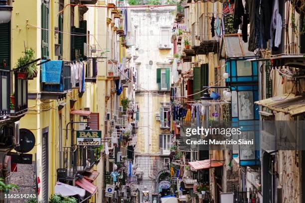 naples, quartieri spagnoli; low angle view of buildings and narrow street - napoli stock pictures, royalty-free photos & images
