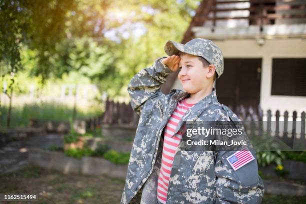 i will be like my dad one time - child saluting stock pictures, royalty-free photos & images