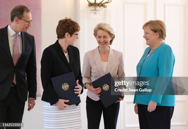 New German Defense Minister Annegret Kramp-Karrenbauer , outgoing Defense Minister Ursula von der Leyen , Michael Mueller, who is both mayor of...