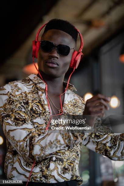 Young black man listening to music with headphones