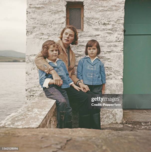 Swedish actress Ingrid Bergman pictured with her twin daughters Isotta and Isabella during shooting of the film 'The Inn of the Sixth Happiness' on...