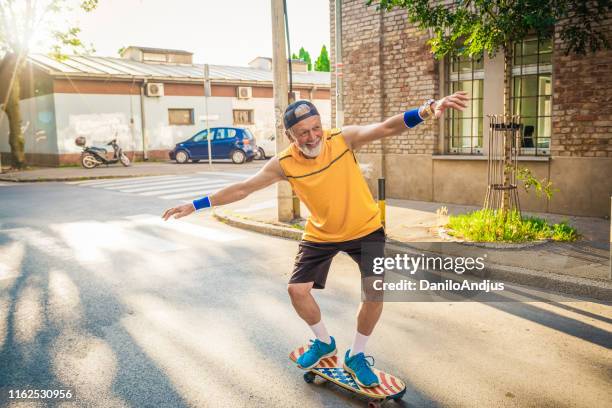 senior man njuter pensionering - young at heart bildbanksfoton och bilder