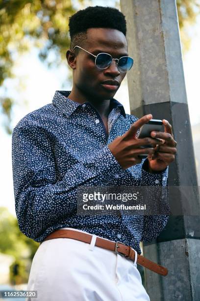 Young black man using a phone