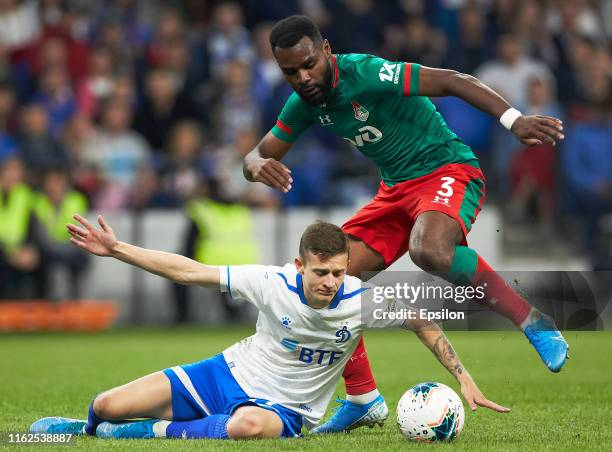 Sebastian Szymanski of FC Dynamo Moscow and Brian Idowu of FC Lokomotiv Moscow vie for the ball during the Russian Football League match between FC...