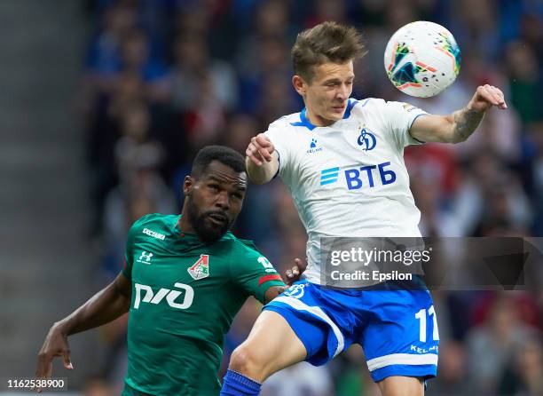 Sebastian Szymanski of FC Dynamo Moscow and Brian Idowu of FC Lokomotiv Moscow vie for the ball during the Russian Football League match between FC...