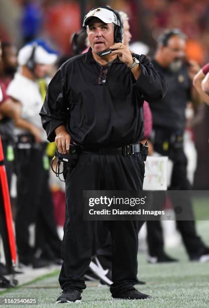 Defensive line coach Jim Tomsula of the Washington Redskins watches the action from the sideline in the fourth quarter of a preseason game against...