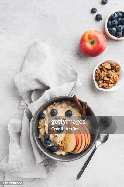 oatmeal porridge with apple and cinnamon - apple plate stock pictures, royalty-free photos & images