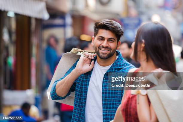 couple enjoying the weekend in the shopping mall stock photo - couple shopping in shopping mall stock pictures, royalty-free photos & images