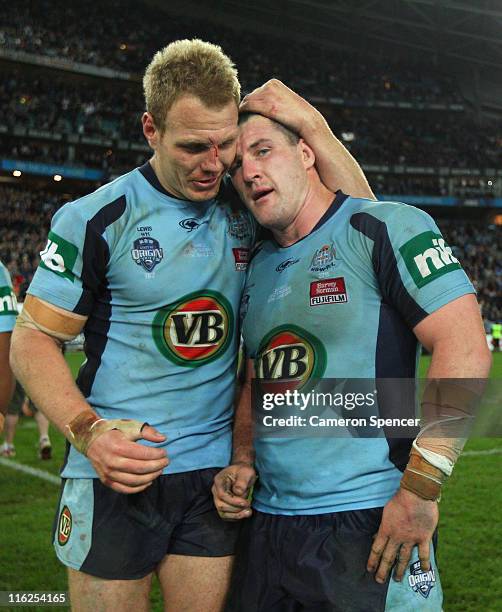 Luke Lewis of the Blues embraces captain Paul Gallen after winning game two of the ARL State of Origin series between the New South Wales Blues and...