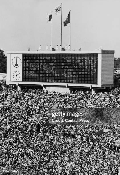 The verse of the Olympic ideal by Baron Pierre de Coubertin founder of the International Olympic Committee is displayed on the scoreboard during the...