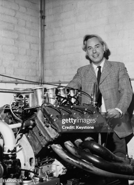 Keith Duckworth , designer of the Ford Cosworth DFV V8 engine poses for a portrait with the magnesium engine at Cosworth Engineering on 3rd January...
