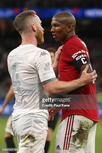 Adam Forshaw of Leeds and Ashley Young of Manchester United exchange words following a tackle during a pre-season friendly match between Manchester...