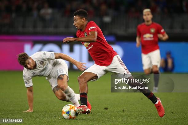 Jesse Lingard of Manchester United controls the ball against Gaetano Berardi of Leeds during a pre-season friendly match between Manchester United...