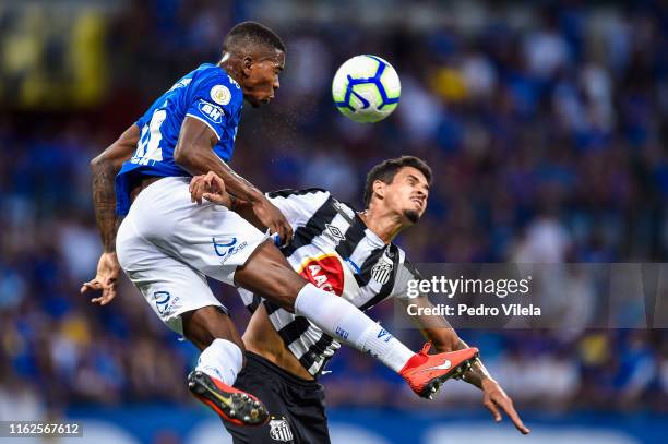 Caca of Cruzeiro and Lucas Verissimo of Santos battle for the ball during a match between Cruzeiro and Santos as part of Brasileirao Series A 2019 at...