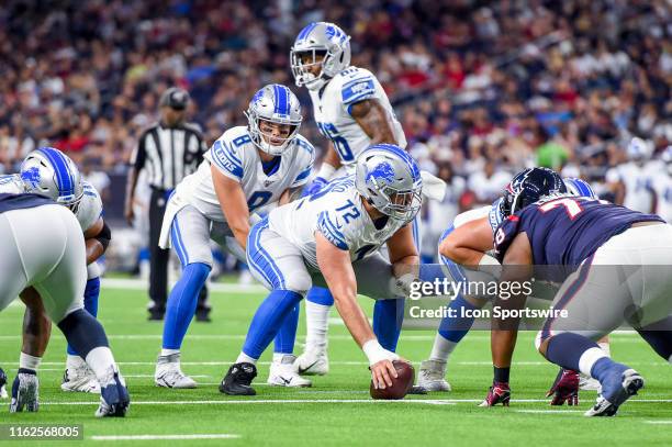 Detroit Lions quarterback David Fales gets ready to take a snap from center Luke Bowanko during a NFL preseason game between the Detroit Lions and...