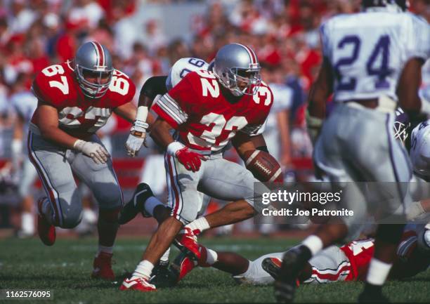 Robert Smith, Running Back for the Ohio State Buckeyes runs the ball during the NCAA Big Ten Conference college football game against the...