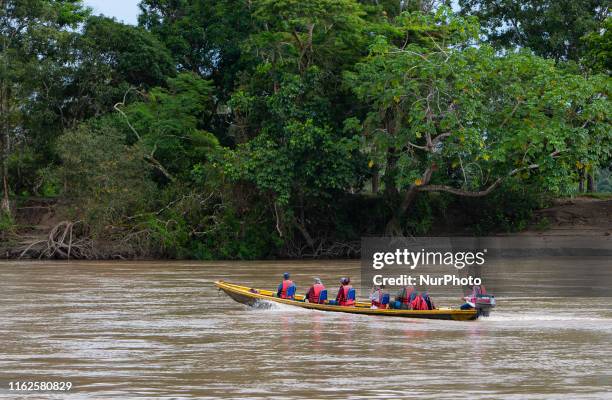 Tourists ride on the Guayabero River in La Macarena Colombia on Monday August 12, 2019. The river is the launching point to Cao Cristales, a...