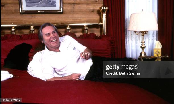 Country Music Singer George Jones on the bed in his home on January 1, 1984 in Colmesneil, Texas
