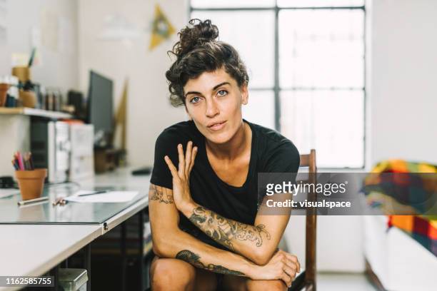portrait of confident female professional at home - female hipster stock pictures, royalty-free photos & images