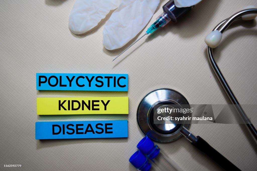 Polycystic Kidney Disease text on Sticky Notes. Top view isolated on office desk. Healthcare/Medical concept