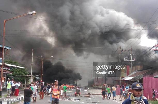 Protesters take to the street to face off with Indonesian police in Manokwari, Papua on August 19, 2019. - Riots broke out in Indonesia's Papua with...