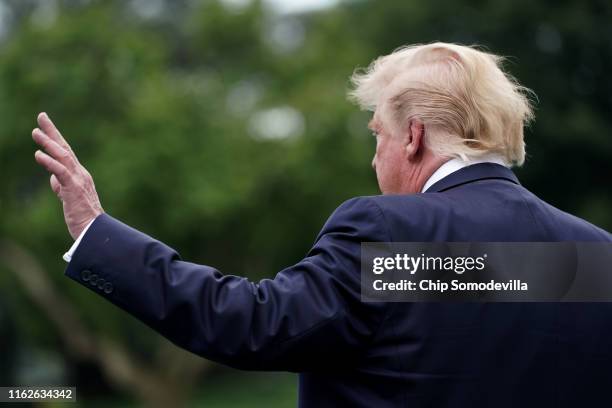 President Donald Trump talks to reporters as he departs the White House for a campaign rally July 17, 2019 in Washington, DC. Trump is traveling to...