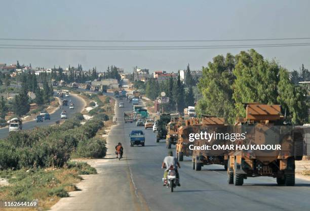 Convoy of Turkish military vehicles passes through the town of Saraqeb in the northwestern province of Idlib reportedly heading toward the town of...