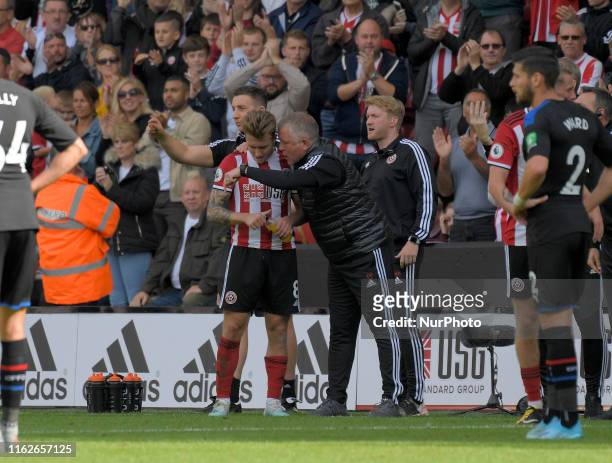 Quiet word from Chris Wilder as Luke Freeman is substitued during English Premier League between Sheffield United and Crystal Palace at Bramall Lane...
