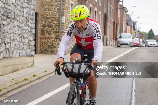 Swiss Stephane Cand's pictured during his attempt to set a new Guinnes Book world record, cycling through 16 countries in 7 days, covering some 2.200...