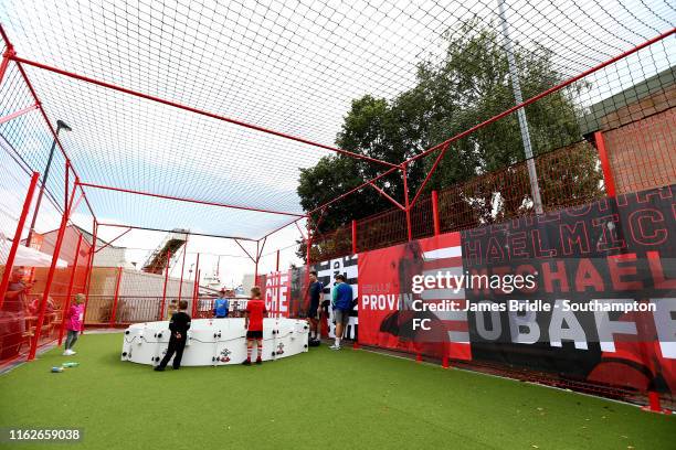 Fans play inside the kids zone at the new Fan Zone located in the South car park ahead of the Premier League match between Southampton FC and...