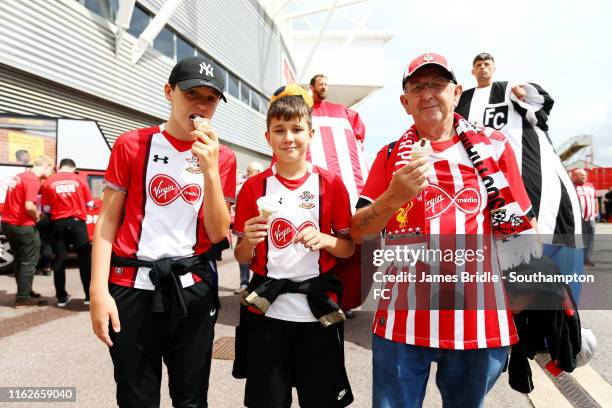 Fans eat free ice cream courtesy of Virgin Media head of the Premier League match between Southampton FC and Liverpool FC at St Mary's Stadium on...