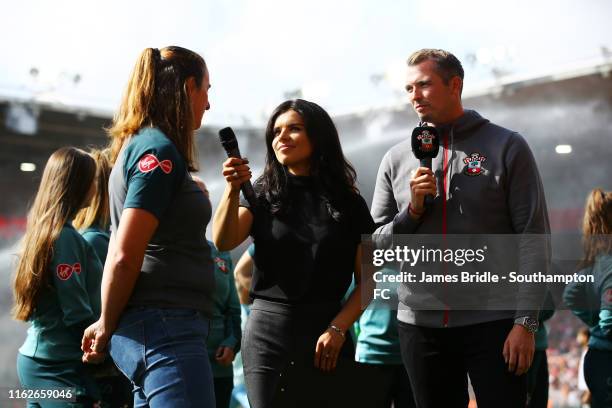 Marieanne Spacey-Cale speaks with Kenzie Benali and Michael Kern at half time for the Premier League match between Southampton FC and Liverpool FC at...