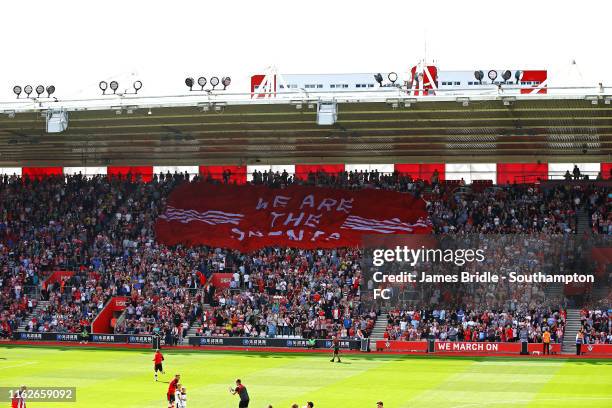 We Are the Saints' flag moving across the crowd ahead of kick off for the Premier League match between Southampton FC and Liverpool FC at St Mary's...