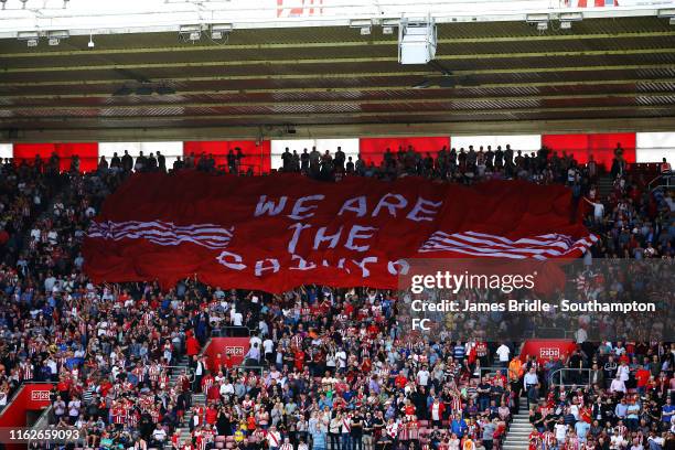 We Are the Saints' flag moving across the crowd ahead of kick off for the Premier League match between Southampton FC and Liverpool FC at St Mary's...