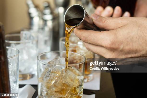 serving a drink - cocktail making stock pictures, royalty-free photos & images