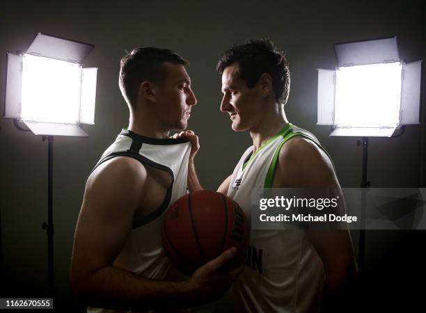 Mitch McCarron of Melbourne United and Ben Madgen of South East Melbourne Phoenix face off during a NBL media opportunity ahead of the season opening...